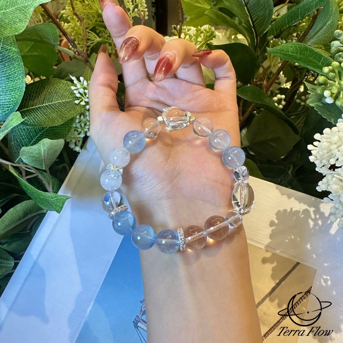wearing-aquamarine-phantom-quartz-bracelet-for-emotional-renewal
