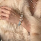 wearing-aquamarine-phantom-quartz-bracelet-for-emotional-renewal