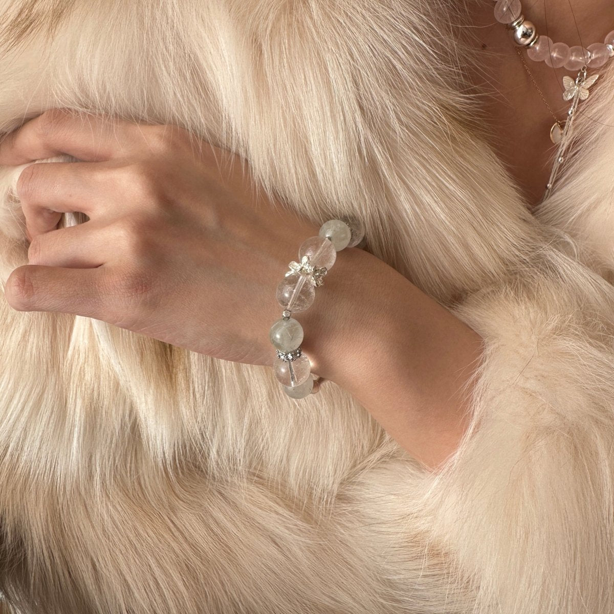 wearing-green-rutile-bracelet-with-bamboo-butterfly-charms