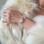 wearing-large-bead-rose-quartz-bracelet-with-wing-charm