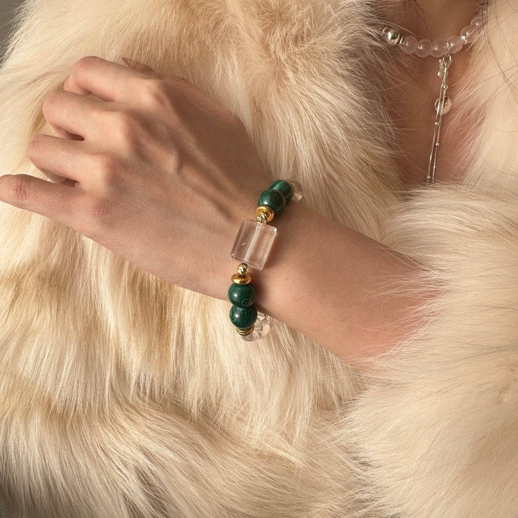wearing-malachite-bracelet-with-gold-accents-for-transformation