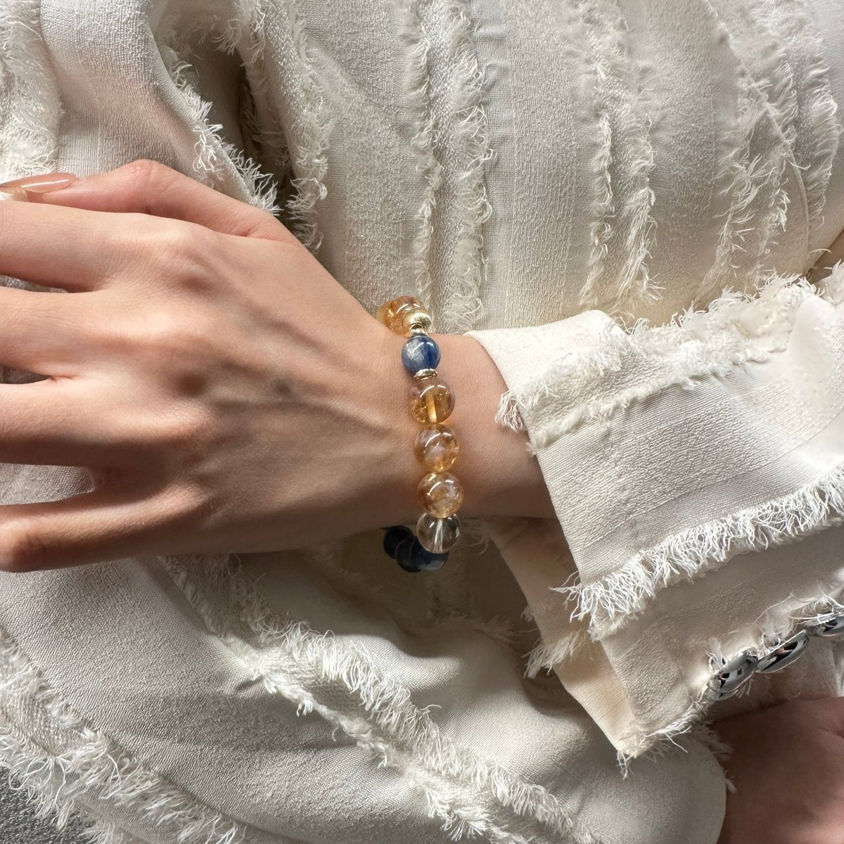 wearing-gold-rutile-blue-kyanite-bracelet-for-prosperity