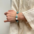 wearing-12mm-amazonite-obsidian-mixed-bracelet-for-confidence
