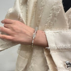 wearing-green-rutile-bracelet-with-bamboo-butterfly-charms