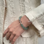 wearing-green-strawberry-quartz-bracelet-for-emotional-healing