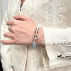 wearing-aquamarine-phantom-quartz-bracelet-for-emotional-renewal