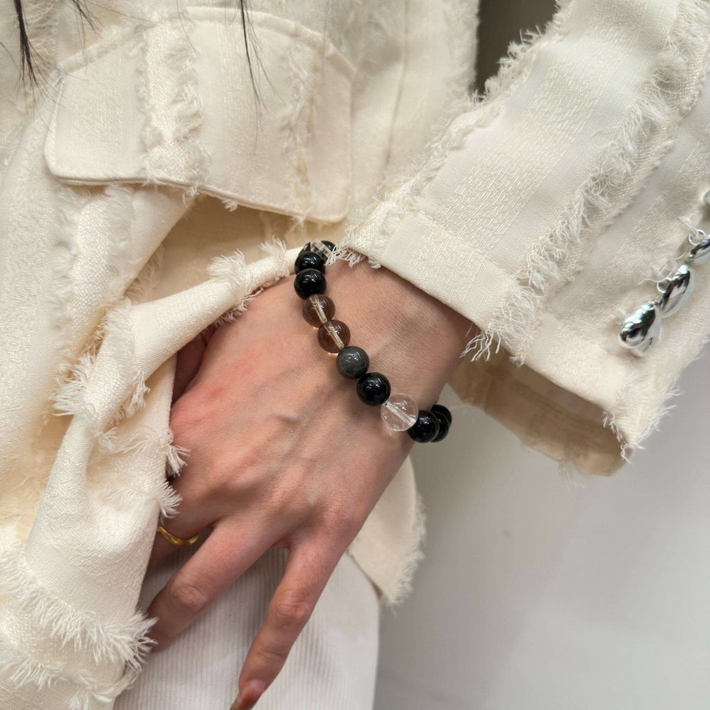 wearing-obsidian-smoky-quartz-bracelet-for-grounding