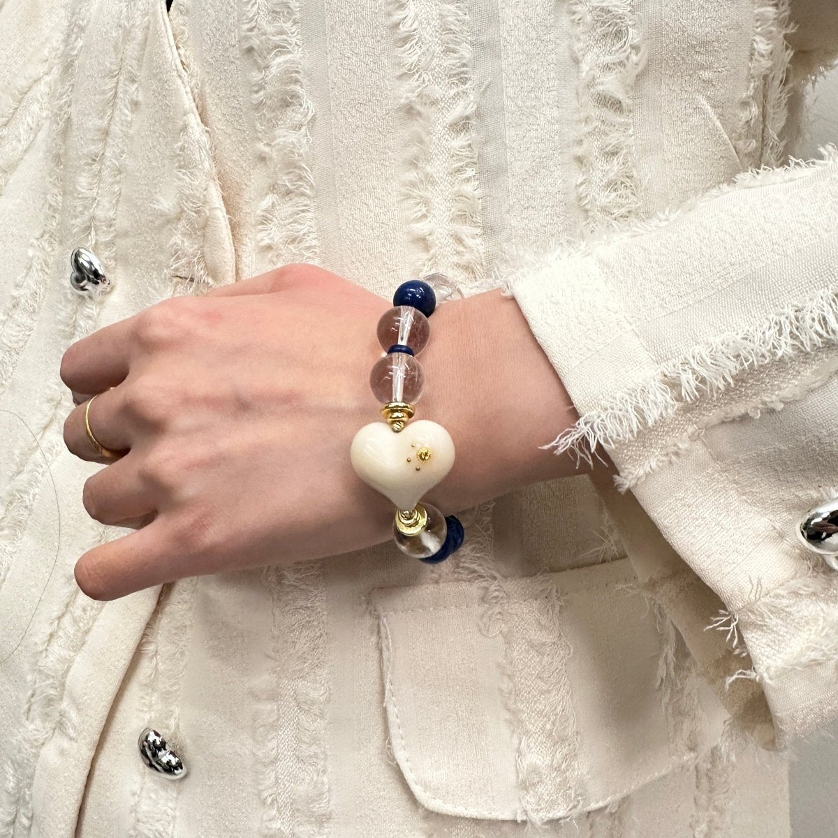 wearing-lapis-lazuli-bracelet-with-white-heart-charm